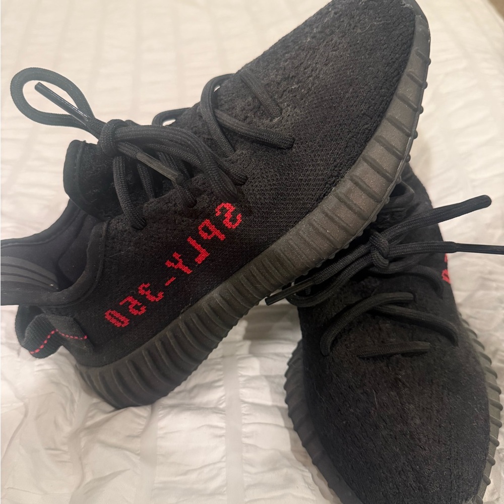 Black Sneakers with Red Detailing